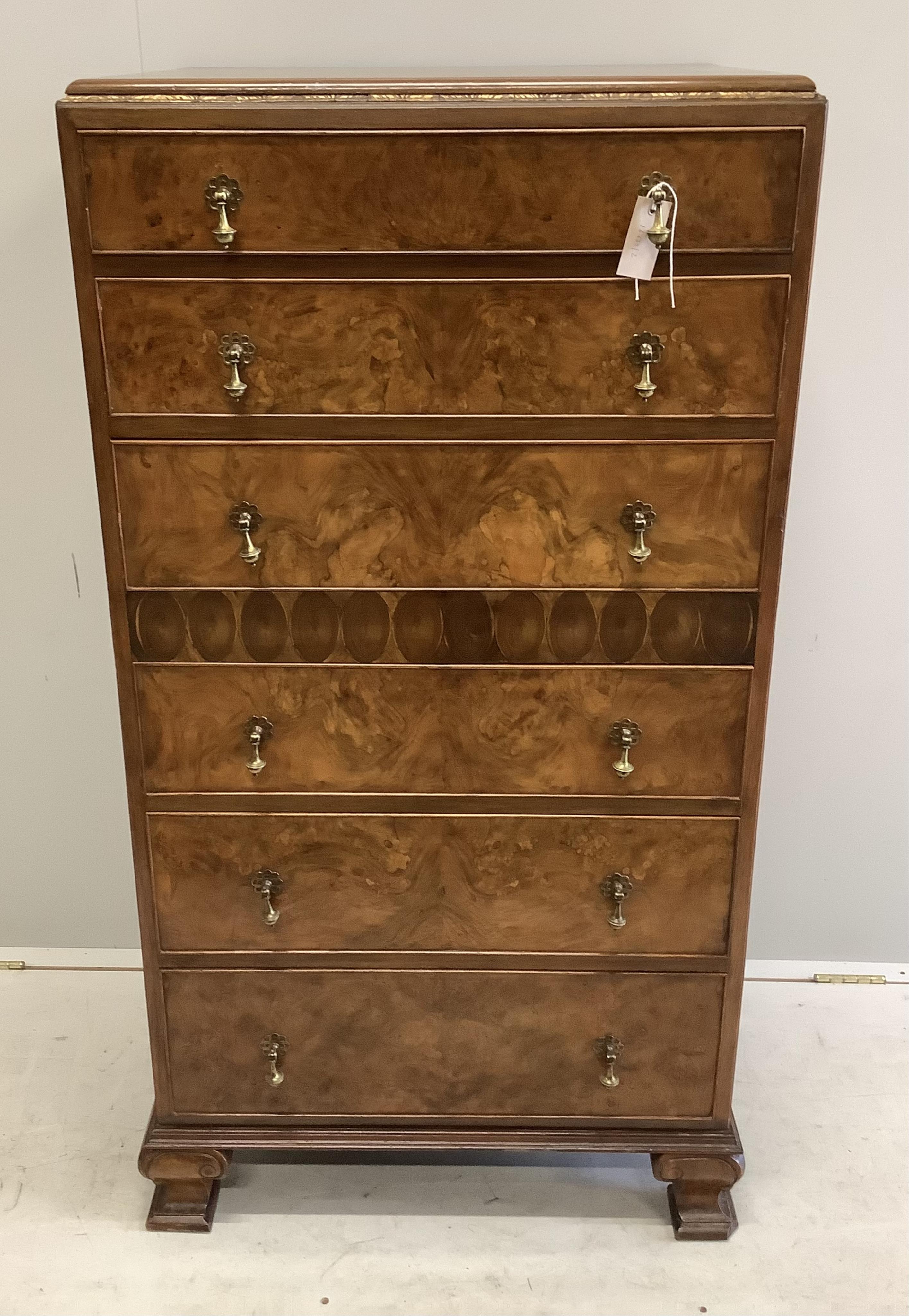 A Queen Anne Revival figured walnut and laburnam oyster veneered six drawer tall chest, width 70cm, depth 53cm, height 134cm. Condition - good